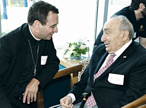 Auxiliary Bishop Andrew Cozzens talks with George Esseff of California, an emeritus member of the Institute for Priestly Formation’s Mission Advisory Council, during IPF’s 25th anniversary celebration in July in Omaha, Nebraska. 
