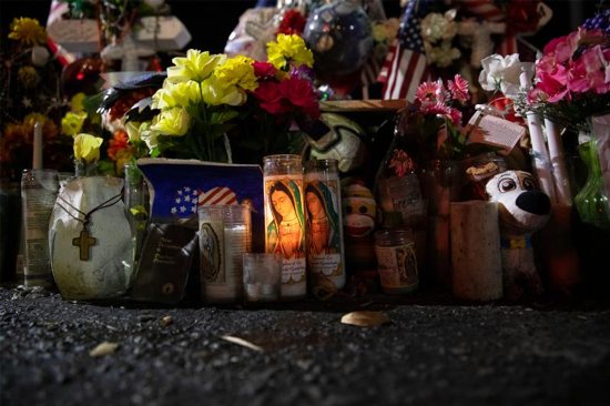 A memorial in El Paso, Texas, is seen at the site of the Aug. 3, 2019, Walmart mass shooting during a Sept. 26 prayer vigil, which was part of a pastoral encounter by U.S. bishops with migrants at the border. The Sept. 23-27 pastoral visit, sponsored by various offices of the U.S. Conference of Catholic Bishops and other national organizations, aimed to highlight the church's ministry to migrants, the border conditions and immigration laws affecting them, and their material and spiritual needs.