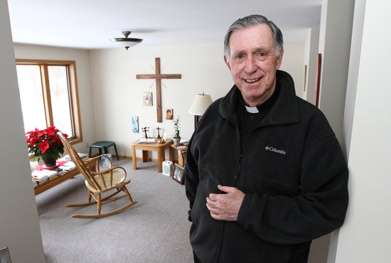 In this file photo from 2014, Father Timothy Nolan stands in his residence at Pacem in Terris hermitage retreat center near Isanti. 