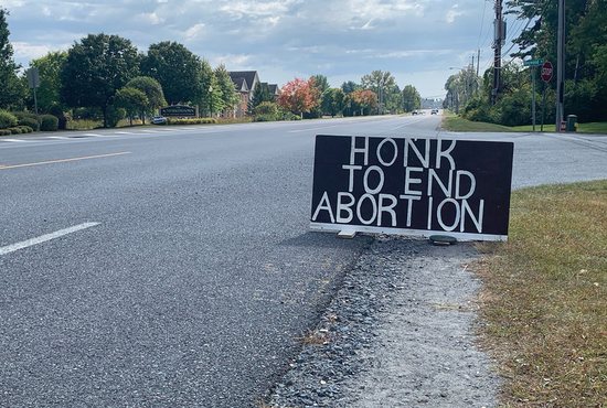 Marcia Brown's "Honk To End Abortion" sign is seen near Planned Parenthood in Queensbury, N.Y., Sept. 23, 2020, the first day of the national 40 Days for Life campaign to end abortion. On Sept. 22, 2021, the Texas-based 40 Days for Life organization started its fall campaign to end abortion in over 1,000 cities with participants planning to pray and fast 24/7 outside abortion facilities.