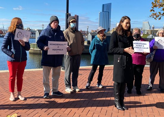 Sarah Pearson, in black jacket, was part of a group of sex abuse survivors who called on U.S. bishops, in a Nov. 16, 2021, press conference in Baltimore, to focus less on who can take Communion and instead do more about sex abuse. Survivors, outside the fall meeting of U.S. bishops, also said they were concerned with the "pernicious idea" from a group protesting nearby that homosexuality is linked to pedophilia and called on bishops and Pope Francis to denounce it. 