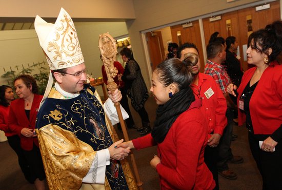 In this 2014 file photo, Bishop Andrew Cozzens greets people at Risen Savior in Burnsville before Mass to celebrate the feast of Our Lady of Guadalupe.