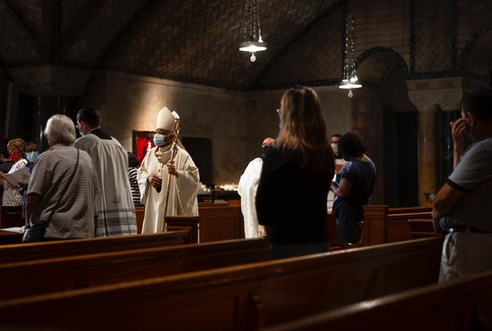 Washington Cardinal Wilton D. Gregory processes into Mass in the Crypt Church at the Basilica of the National Shrine of the Immaculate Conception in Washington Sept. 16, 2021. The percentage of Catholics in the U.S. population in 2021 held steady at 21% in the latest Pew Research Center survey, issued Dec. 14.