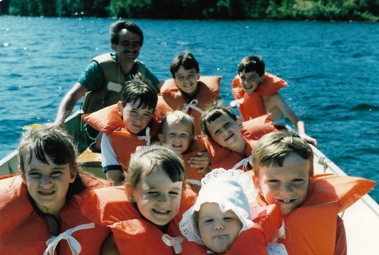 The nine Williams children boat with their parents in 1986 at Butternut Point Resort near Pequot Lakes where they annually spent a weeklong vacation. Mary Williams, their mom, was the photographer. Pictured, at top from left, are Gary (dad), Matthew and John; second row from left, Joseph, Paul and Mark; and first row, from left, Mara, Anne, Katherine and Peter.