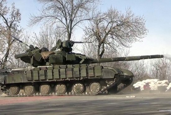 A tank fires amid Russia's ongoing invasion of Ukraine, in this still image taken from video released March 20, 2022, by the Ukrainian Armed Forces, which said it says shows the frontline near Kharkiv, Ukraine.