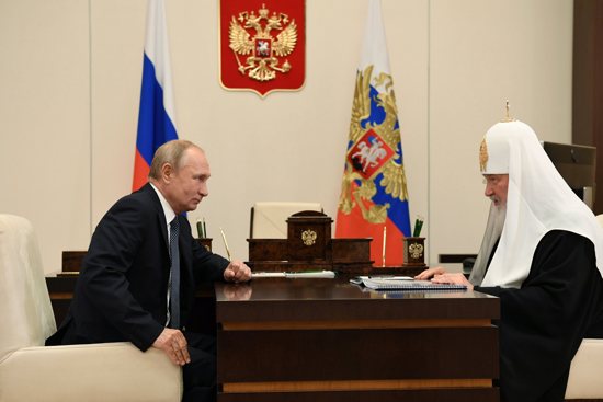 Russian President Vladimir Putin meets with Russian Orthodox Patriarch Kirill of Moscow at the Novo-Ogaryovo state residence outside Moscow in this Nov. 20, 2020, file photo. Church leaders have appealed to Patriarch Kirill to intervene and ask President Putin to stop the bloodshed in Ukraine.