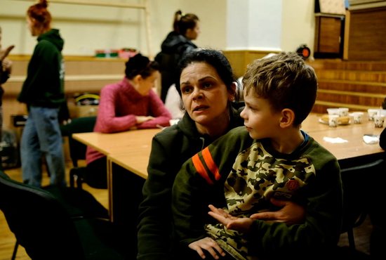 Natalia Skorobagach is pictured with her son, Tymofei, at the Central Baptist Church in Lviv, Ukraine, March 8, 2022. Ukrainians forced to flee cities being bombed or besieged by Russia have found safety and help in Lviv.