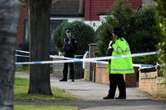 Police officers guard the site where Sir David Amess, a member of the governing Conservative Party, was stabbed while meeting constituents in Leigh-on-Sea, England, Oct. 15, 2021. Following the outcry over the murder, police in England have changed guidance to allow priests to access crime scenes to give last rites to dying Catholics. 