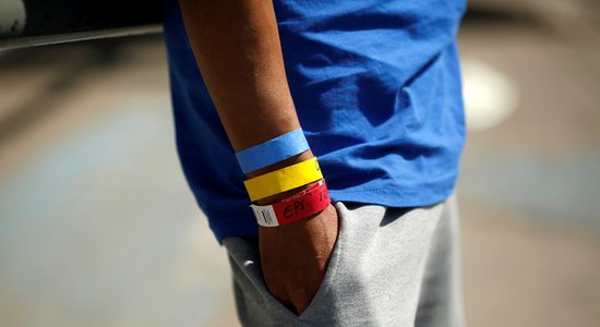 Bracelets used by the U.S. Border Patrol are seen on the arm of a Central American migrant near the Paso del Norte international border bridge in Ciudad Juarez, Mexico, Oct. 1, 2021. The migrant was expelled from the U.S. and sent back to Mexico under Title 42.
