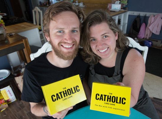 Matt and Lisa Martinusen with their Catholic card game.