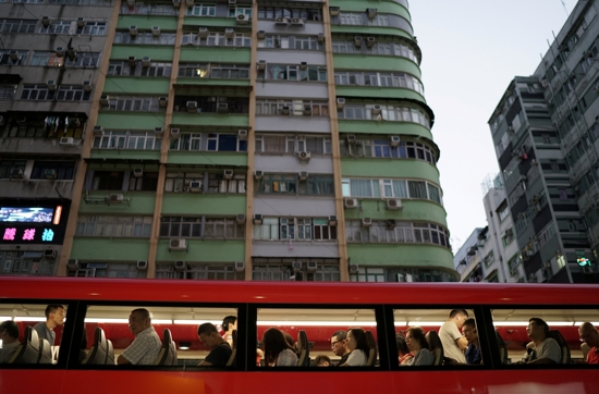 Commuters are seen on a double-decker bus in Hong Kong Oct. 17, 2019. 