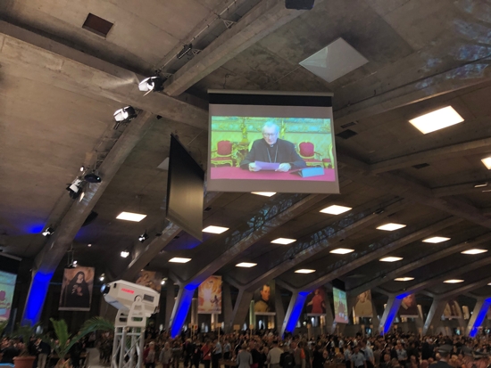 A video message by Cardinal Pietro Parolin, Vatican secretary of state, is broadcast at the International Military Pilgrimage in Lourdes, France, May 13, 2022. In his message, Cardinal Parolin encouraged military personnel to download "Catholic Military Connect," an app that provides easy access to answers to military questions, prayers for the military, testimonies, and connects military personnel with chaplaincies around the world.