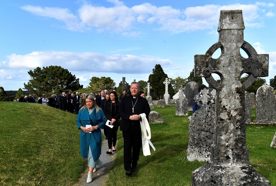 Archbishop Eamon Martin of Armagh, Northern Ireland, leads delegates on a prayer walk at a pre-synodal assembly in the sixth-century monastic site of Clonmacnoise in Ireland June 18, 2022. It was in preparation for the universal synod convened by Pope Francis for 2021-2023. 