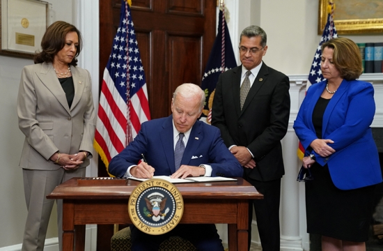 President Joe Biden signs an executive order at the White House in Washington July 8, 2022, that he said would help safeguard women's access to abortion and contraceptives. He stated the order was a necessary response to the Supreme Court's June 24 decision overturning the court's 1973 Roe v. Wade decision that legalized abortion nationwide. The high court's ruling sends the abortion issue back to the states. Pictured with Biden are Vice President Kamala Harris, left, Health and Human Services Secretary Xavier Becerra and . Deputy Attorney General Lisa Monaco.