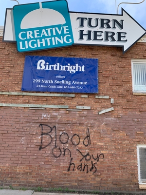 Some of the graffiti that defaced Birthright crisis pregnancy center in St. Paul July 5.