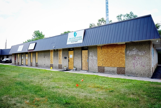 The windows and doors of the Lennon Pregnancy Center in Dearborn Heights, Mich., have been boarded up since a June 20, 2022, attack, during which vandals left a message reading, "If abortion isn't safe, neither are you."