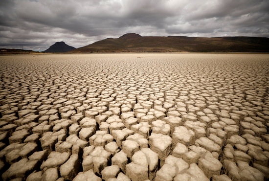 Clouds gather but produce no rain as cracks are seen in the dried-up municipal dam in drought-stricken Graaff-Reinet, South Africa, Nov.14, 2019. In a July 13, 2022, message to participants of a Vatican conference on climate change, Pope Francis said humanity has a "moral obligation" to protect the environment and combat climate change.