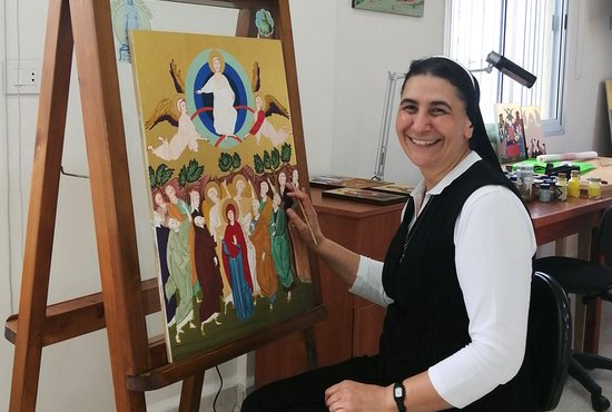Melkite Sister Souraya Herro poses with some of her artwork in her workshop at the convent of Our Lady of the Annunciation in Zouk Mosbeh, Lebanon, Sept. 7, 2022.