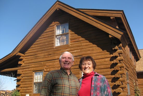 Jim and Donna May outside their log home in rural Northfield. Jim built the house with his father-in-law.