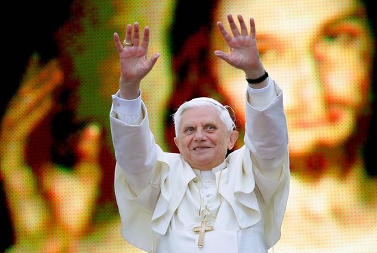 Pope Benedict XVI greets an estimated 600,000 youths while standing in front of a huge portrait of Jesus Christ in Krakow, Poland, May 27, 2006.